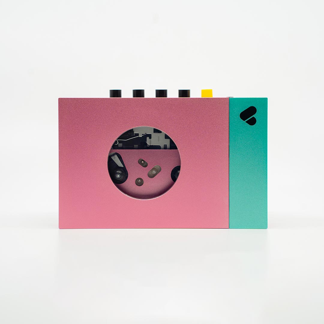 Pink-grüner Kassettenspieler + Bluetooth-Kopfhörer